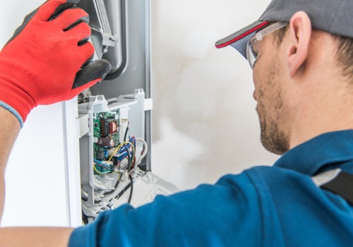 Man Preforming a Residential Heating Service in the St. Louis MO area