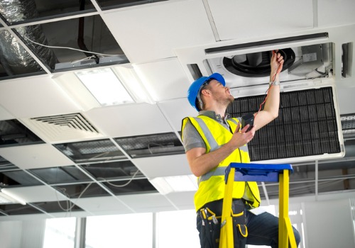 Contractor fixing ventilation for a business during HVAC Repair in the St. Louis MO area