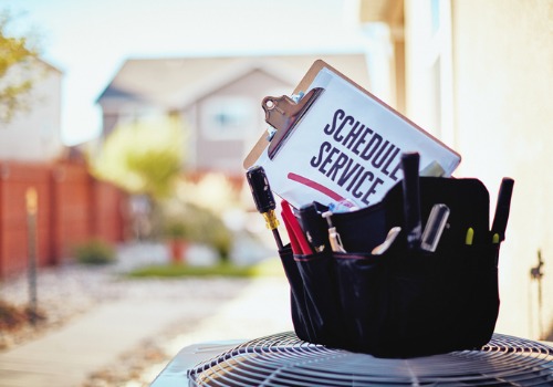 Tools sitting on an AC unit, representing Air Conditioning Services in Kirkwood MO