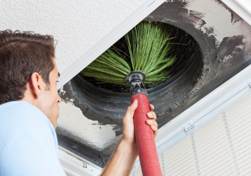A man performing duct cleaning in the St. Louis MO area