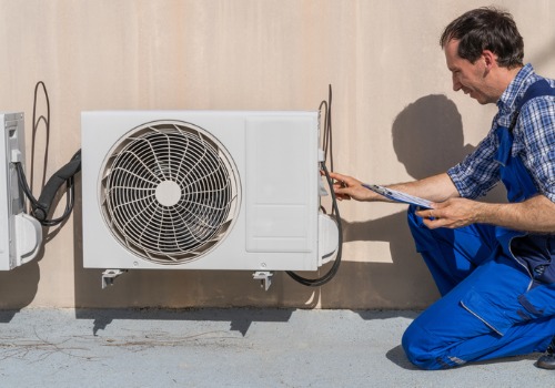 A technician performing Cooling Maintenance in the St. Louis MO area