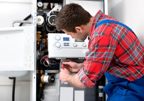 A trained service technician performing Boiler Replacement in St. Louis MO