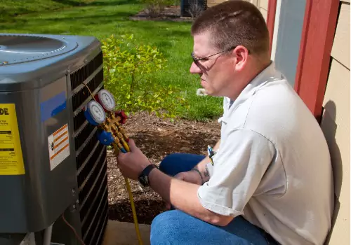 A technician is seen working on a system. Xcell Williams Heating & Cooling offers HVAC service.
