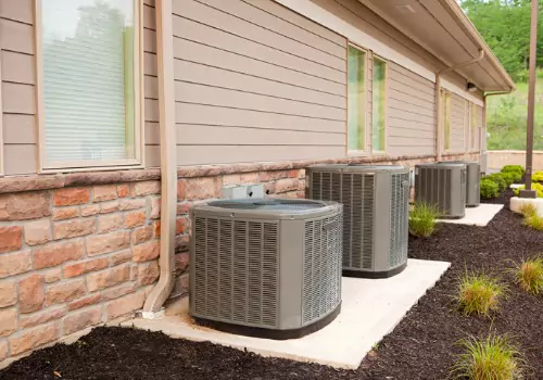 A row of HVAC units is seen. Xcell Williams performs AC Maintenance in Warrenton MO.