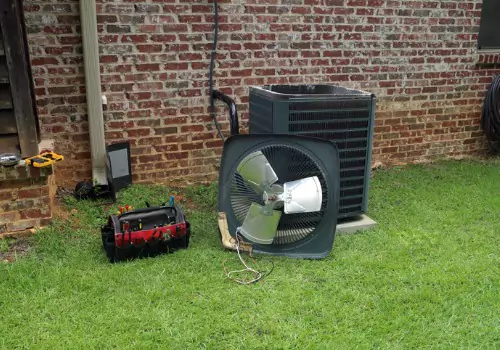  An air conditioning unit under repair is seen. Xcell Williams does cooling service in Wentzville MO. 