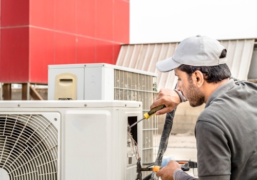 A tech is seen providing maintenance. Xcell Williams performs heating and cooling maintenance.