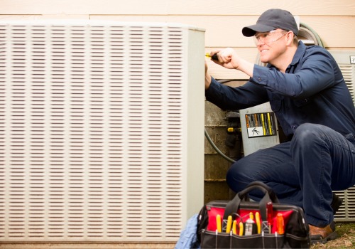 A technician offers Air Conditioning Services in Warrenton MO